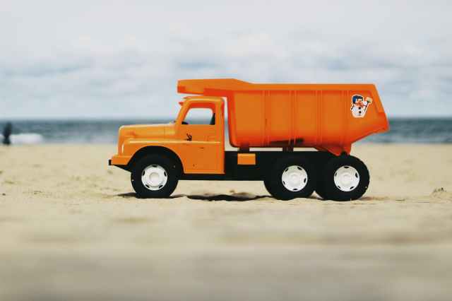 photo of orange dump truck toy