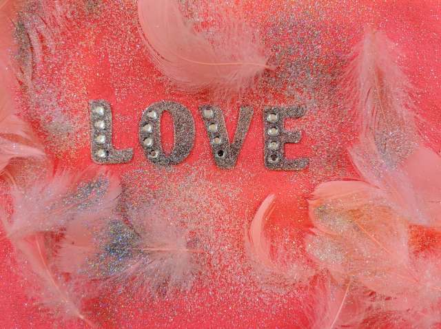 pink love fabric decor with feathers